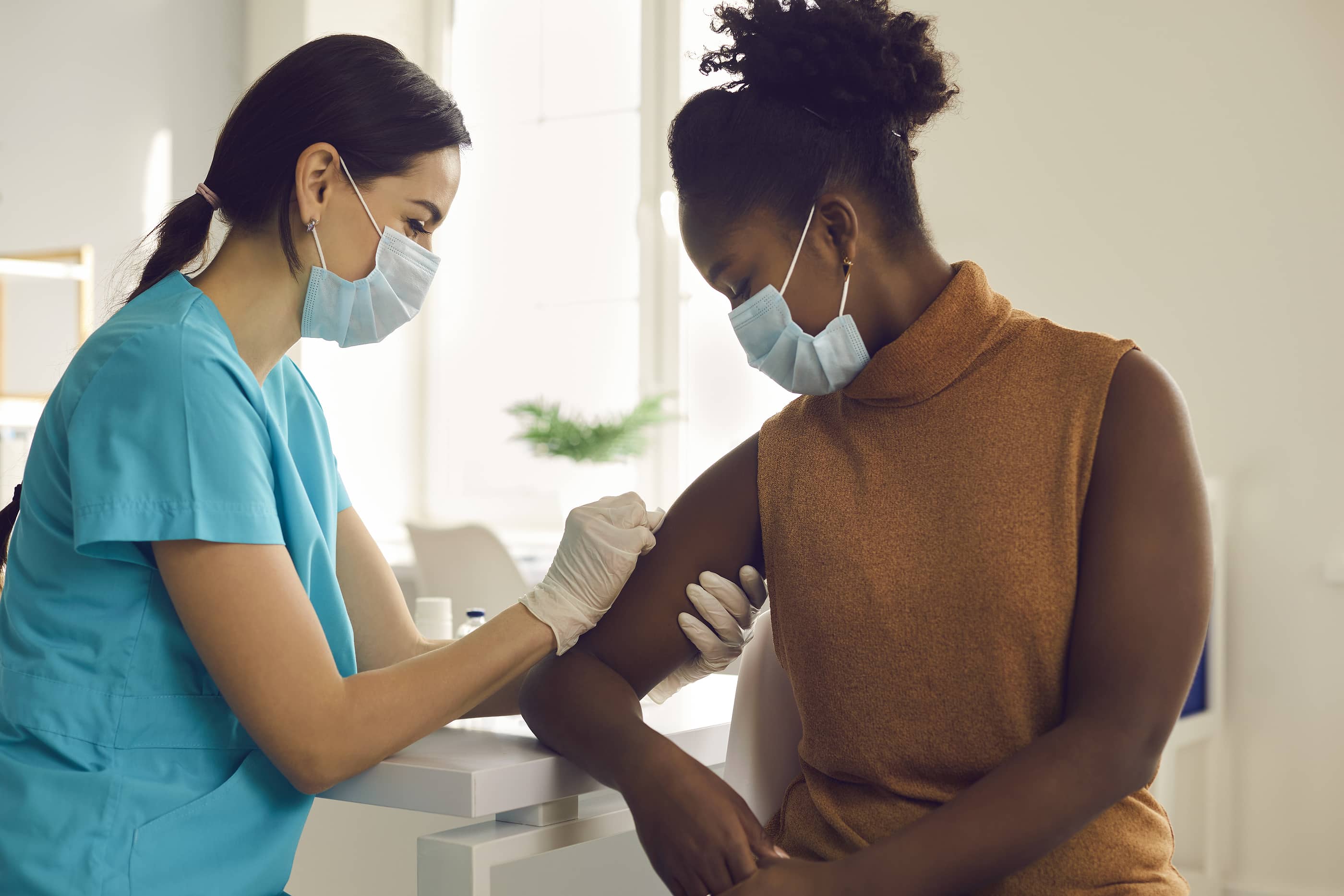 Woman receiving COVID vaccine